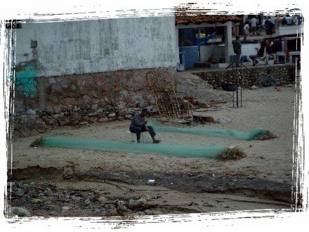 Man repairing a fishing net